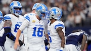 Detroit Lions' Jared Goff (16) and David Montgomery (5) celebrate a touchdown scored by Montgomery against the Dallas Cowboys in the first half of an NFL football game in Arlington, Texas, Sunday, Oct. 13, 2024.