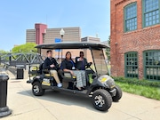 Genesee County Sheriff Chris Swanson and Valley Area Agency on Aging President Yaushica Aubert drive the UM-Flint Department of Public Safety vehicle that will be used by UM-Flint's River Trail Watchers program.