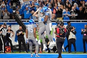 Detroit Lions tight end Sam LaPorta (87) is congrautalted by tight end James Mitchell (82) after LaPorta's 2-yard touchdown reception during the first half of an NFL football game against the Minnesota Vikings, Sunday, Jan. 7, 2024, in Detroit. (AP Photo/Paul Sancya)