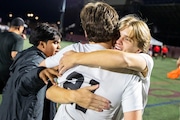 Byron Center celebrates their win during the division 1 boys soccer regional semifinals between Grand Haven and Byron Center at Grandville High School Grandville, Mich. on Tuesday, October 22, 2024. Byron Center won the game in a shootout, 2-1.