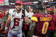 Tampa Bay Buccaneers quarterback Baker Mayfield (6) greets Washington Commanders cornerback Mike Sainristil (0) after an NFL football game Sunday, Sept. 8, 2024, in Tampa, Fla. (AP Photo/Chris O'Meara)