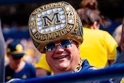 A Michigan fan wears a 2023 national champions ring hat during Michigan vs Arkansas State Football game at Michigan Stadium in Ann Arbor on Saturday, Sept. 14, 2024. Michigan won 28-18. 