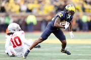 Michigan wide receiver Semaj Morgan runs by Ohio State cornerback Denzel Burke (10) during the game at Michigan Stadium in Ann Arbor on Saturday, Nov. 25, 2023. (Neil Blake | MLive.com)