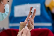 A nurse fils a syringe with the Pfizer-BioNTech COVID-19 vaccine at the Kalamazoo Expo Center in Kalamazoo, Michigan on Wednesday, May 5, 2021. (Joel Bissell | MLive.com)