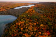 An aerial image of fall colors along Long Lake, Rush Lake and Platte Lake in Benzie County, Mich. on Friday, Oct. 18, 2024.