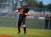 Leslie's Joel Cranmore (12) throws the ball during a high school football game at Leslie High School on Friday, Sept. 27, 2024. Leslie won the game over Manchester, 45-28, on homecoming night.
