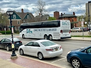 A D2A2 Detroit-Ann Arbor bus across from the downtown Ann Arbor library on Fifth Avenue on April 20, 2024. (Ryan Stanton | MLive.com)