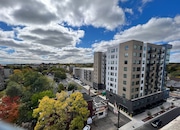 A view looking south toward Michigan Stadium from downtown Ann Arbor with The Standard, a new 10-story apartment high-rise at the corner of Main and William streets, in the foreground on Oct. 7, 2022.