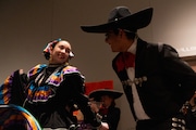 Hannah Nettleton, 27, and Rafael Flores-Rodela, 24, perform at the Flint Institute of Arts for Dia De Los Muertos on Wednesday, Nov. 1, 2023. 