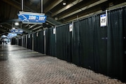Vaccination pods line the Adams Street concourse at Ford Field in Detroit, on Thursday, March 18, 2021. The mass vaccination clinic is scheduled to open March 22 for people ages 50-64 and 16-49 with disabilities or preexisting conditions. (Mike Mulholland | MLive.com)