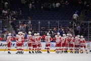 The Detroit Red Wings celebrate after an NHL hockey game against the New York Islanders Tuesday, Oct. 22, 2024, in Elmont, N.Y. The Red Wings won 1-0. (AP Photo/Frank Franklin II)