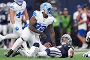 Detroit Lions defensive end Josh Paschal (93) celebrates after sacking Dallas Cowboys quarterback Dak Prescott (4) in the first half of an NFL football game in Arlington, Texas, Sunday, Oct. 13, 2024. (AP Photo/LM Otero)