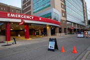 Kent County health officials Sunday reported a third death from the coronavirus COVID-19. Pictured are signs directing medical traffic near Spectrum Health's COVID-19 triage screening area outside the Emergency Department at lth Butterworth Hospital in Grand Rapids on Wednesday, March 18, 2020. (Cory Morse | MLive.com)