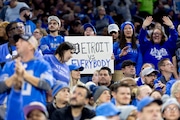Fans celebrate after a touchdown during the first half of the last regular season game against the Minnesota Vikings on Sunday, Jan. 7, 2024 at Ford Field in Detroit.