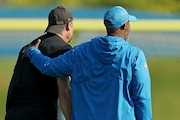 Detroit Lions general manager Brad Holmes checks on head coach Dan Campbell after Campbell worked out with defensive backs during their training camp practice at their team headquarters in Allen Park, on Wednesday, July 28, 2021. (Mike Mulholland | MLive.com)