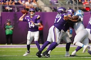 Minnesota Vikings quarterback Sam Darnold (14) throws against the Detroit Lions during the second half of an NFL football game Sunday, Oct. 20, 2024, in Minneapolis. (AP Photo/Bruce Kluckhohn)