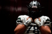 Kalamazoo United lineman Brody Bell (78) prepares in the locker room during a football game at Parchment High School on Friday, Oct. 18, 2024. Kalamazoo United won 35-13, clinching the SAC-Lakeshore conference championship.
